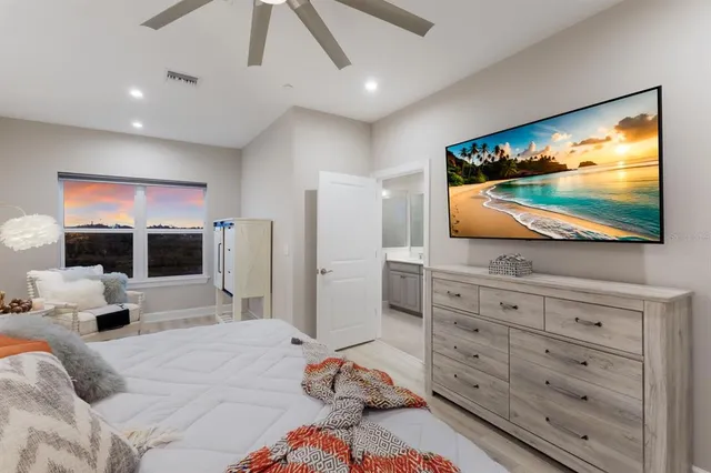 a bathroom with a double vanity sink mirror and shower