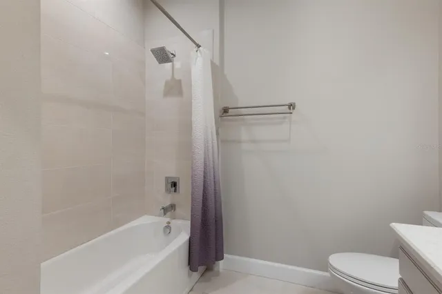 a view of a brick house with many windows