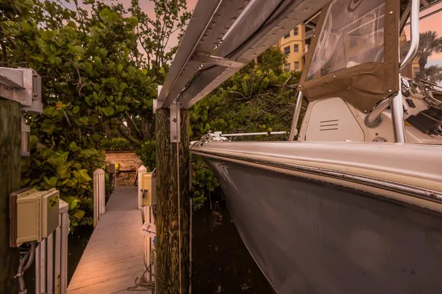 a view of a city with tall buildings and a big yard with swimming pool and mountain view