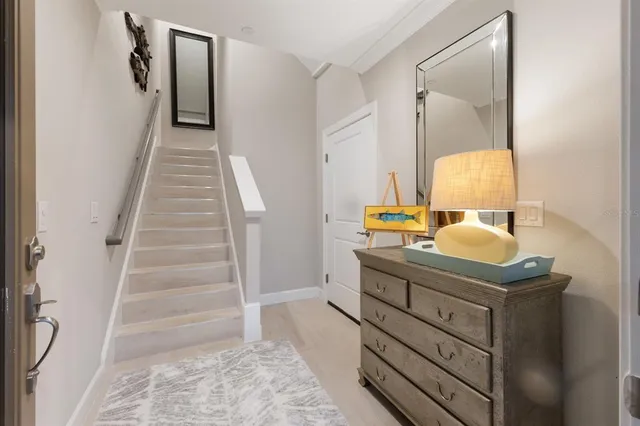 a kitchen with wooden cabinets and refrigerator