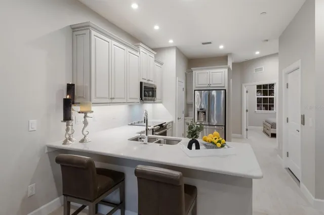 a kitchen with stove and cabinets