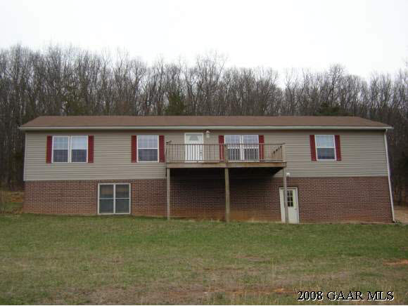 656 Curry Road Churchville, VA 24421 - Photo 1 of 3 a front view of a house with a garden