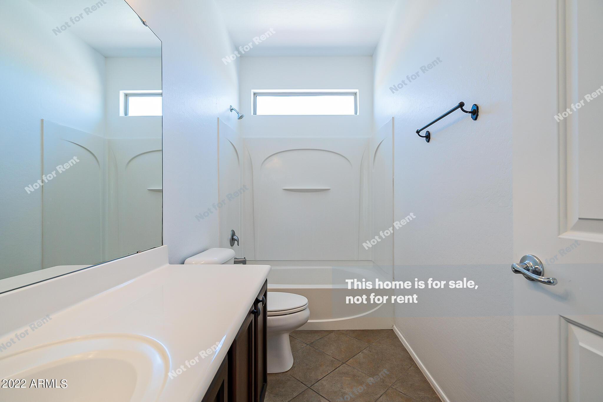899 East Devon Road Gilbert, AZ 85296 - Photo 16 of 23 a bathroom with a granite countertop sink a toilet and shower