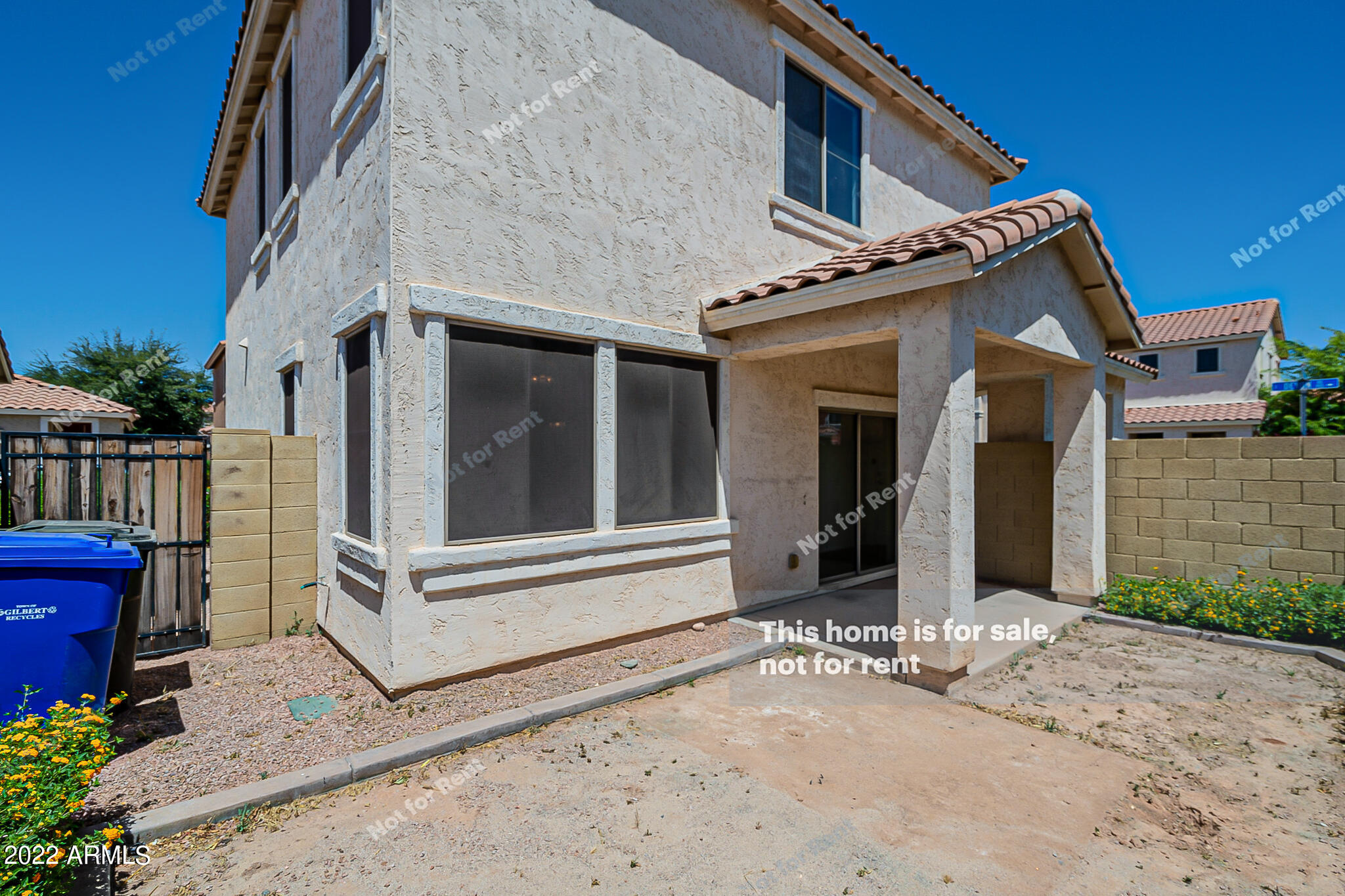 899 East Devon Road Gilbert, AZ 85296 - Photo 23 of 23 a view of a house with a door and wooden walls