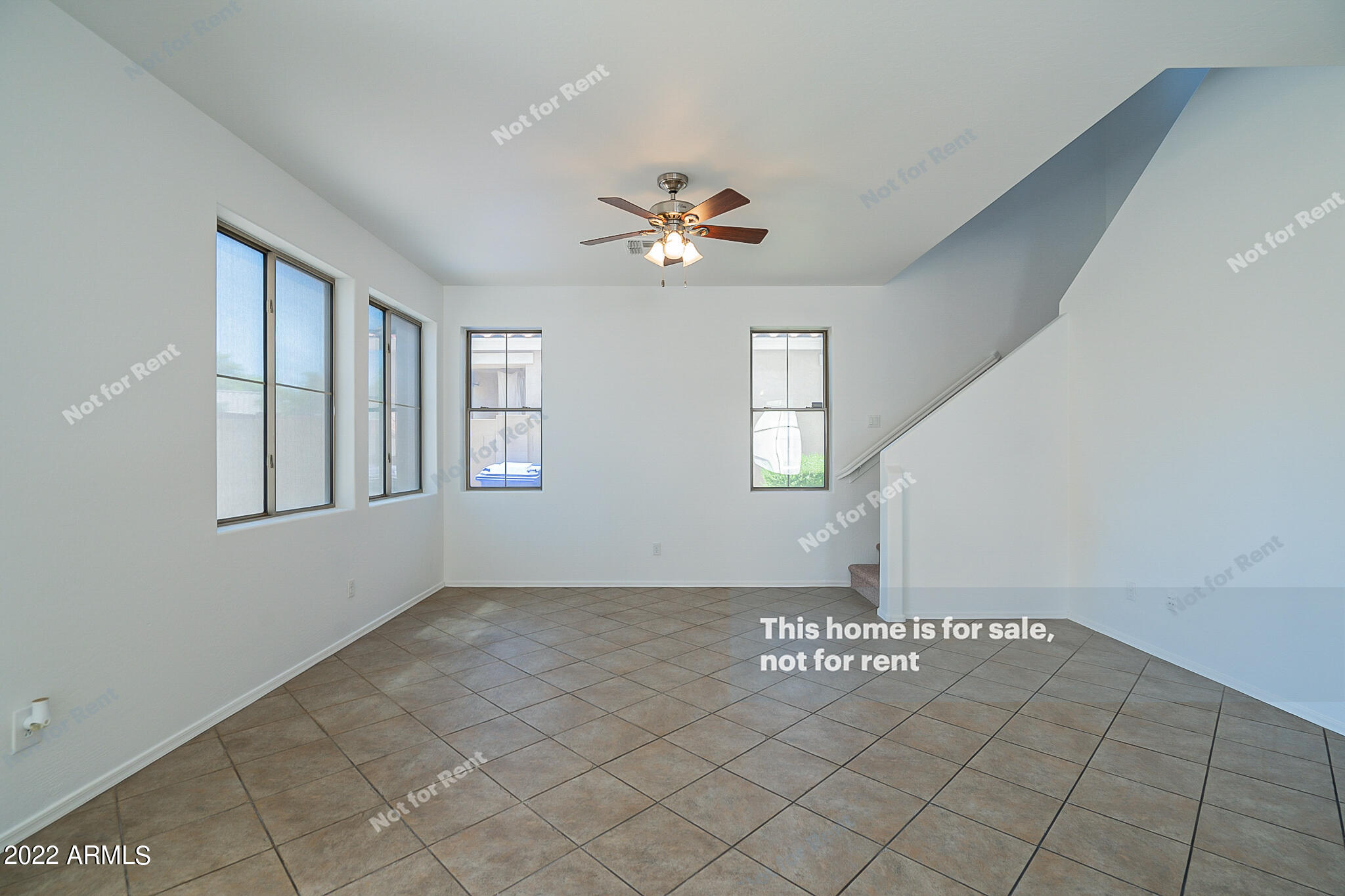 899 East Devon Road Gilbert, AZ 85296 - Photo 3 of 23 a view of an empty room with chandelier fan