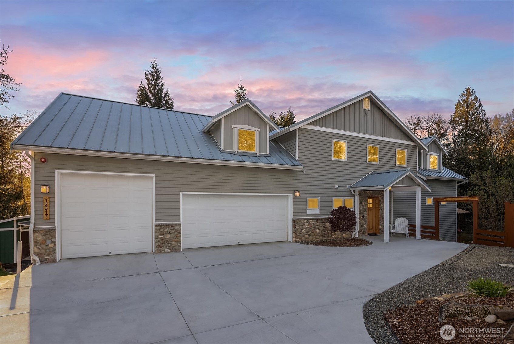 12317 176th Avenue Southeast Renton, WA 98059 - Photo 1 of 39 a front view of a house with a garage