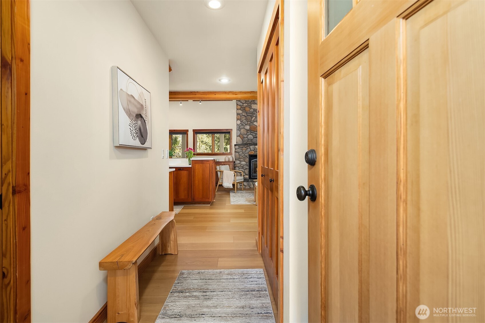 12317 176th Avenue Southeast Renton, WA 98059 - Photo 2 of 39 a hallway with sliding door and couch
