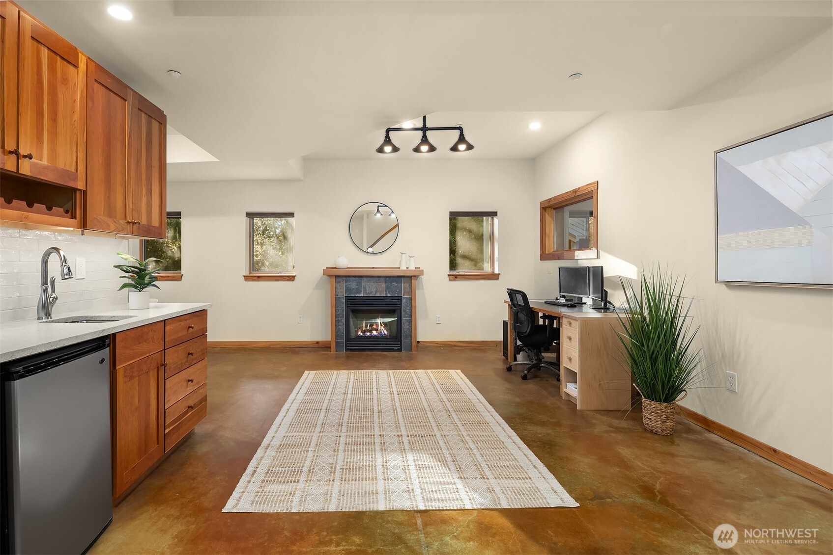 12317 176th Avenue Southeast Renton, WA 98059 - Photo 27 of 39 a living room with furniture and a fireplace