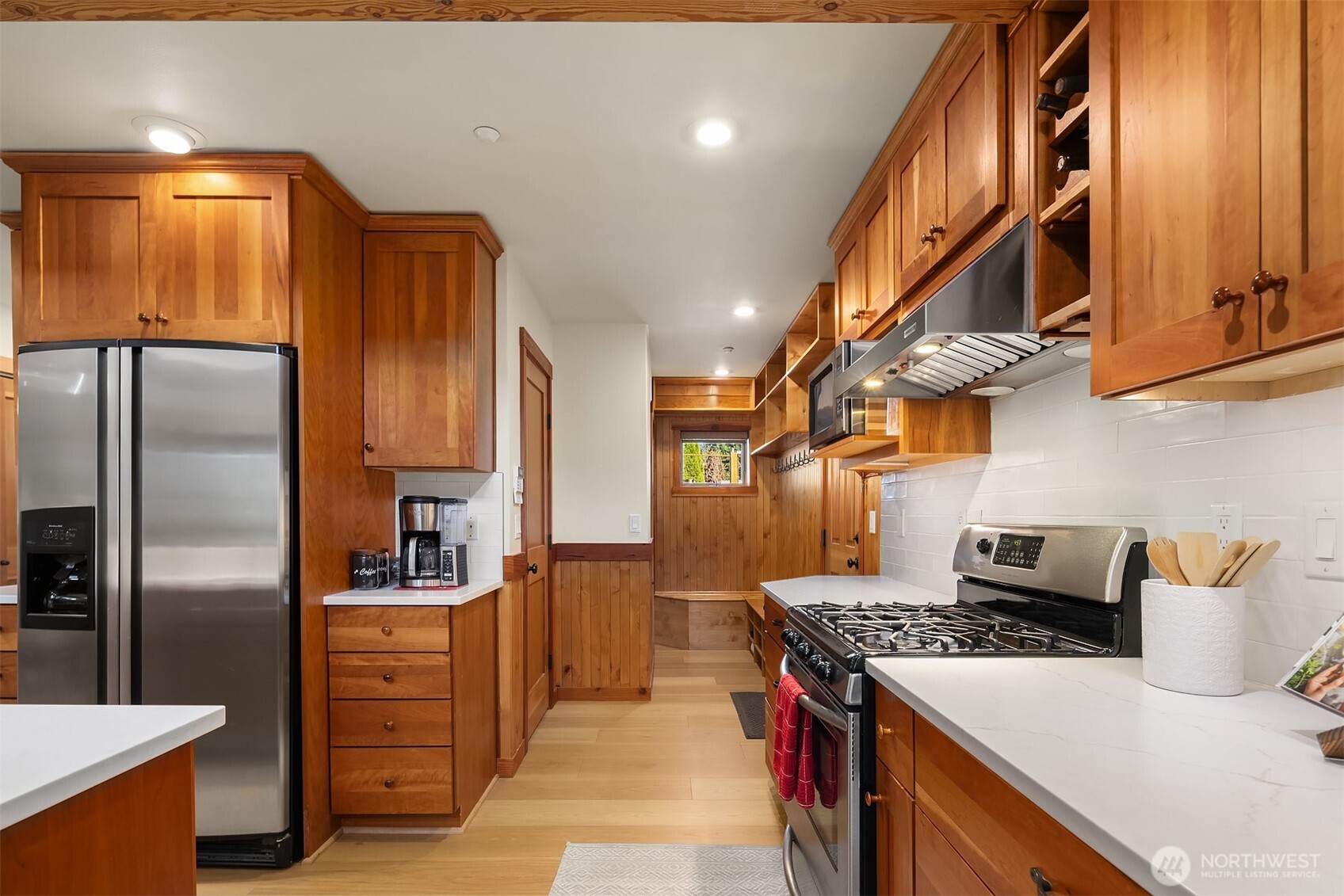 12317 176th Avenue Southeast Renton, WA 98059 - Photo 9 of 39 a kitchen with stainless steel appliances granite countertop a stove a refrigerator and a sink
