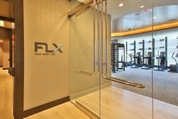 a bathroom with a glass shower door