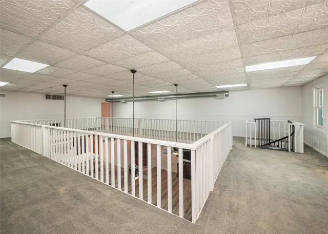 a view of a hallway with stairs