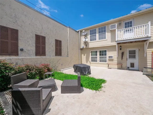a front view of a house with garden and porch