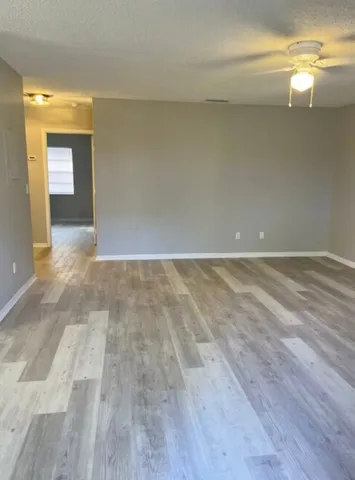 a view of an empty room and window