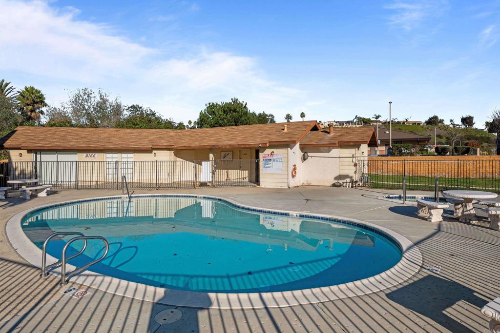 5120 North River Road, Unit E Oceanside, CA 92057 - Photo 13 of 13 a view of a swimming pool with a patio