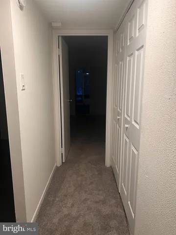 a white toilet sitting next to a bath tub