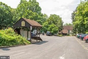 a view of a backyard with table and chairs