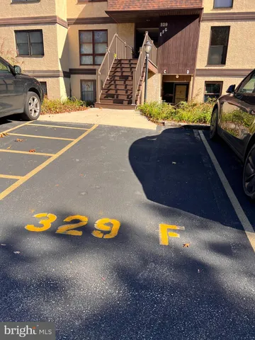 a front view of a house with parking space