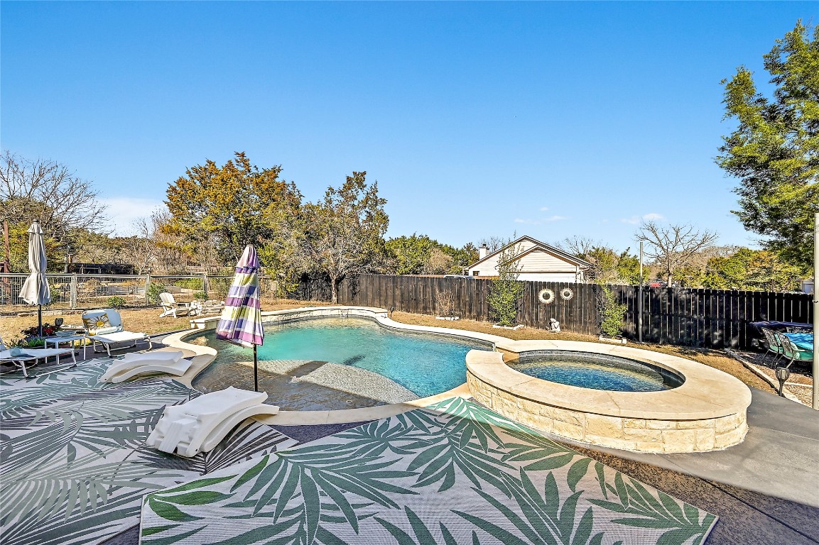 1 Rolling Hills Road Wimberley, TX 78676 - Photo 24 of 30 a view of a swimming pool and outdoor space