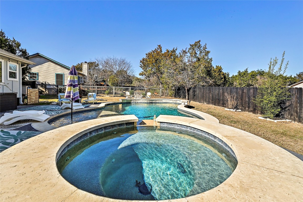1 Rolling Hills Road Wimberley, TX 78676 - Photo 25 of 30 a swimming pool with outdoor seating and yard