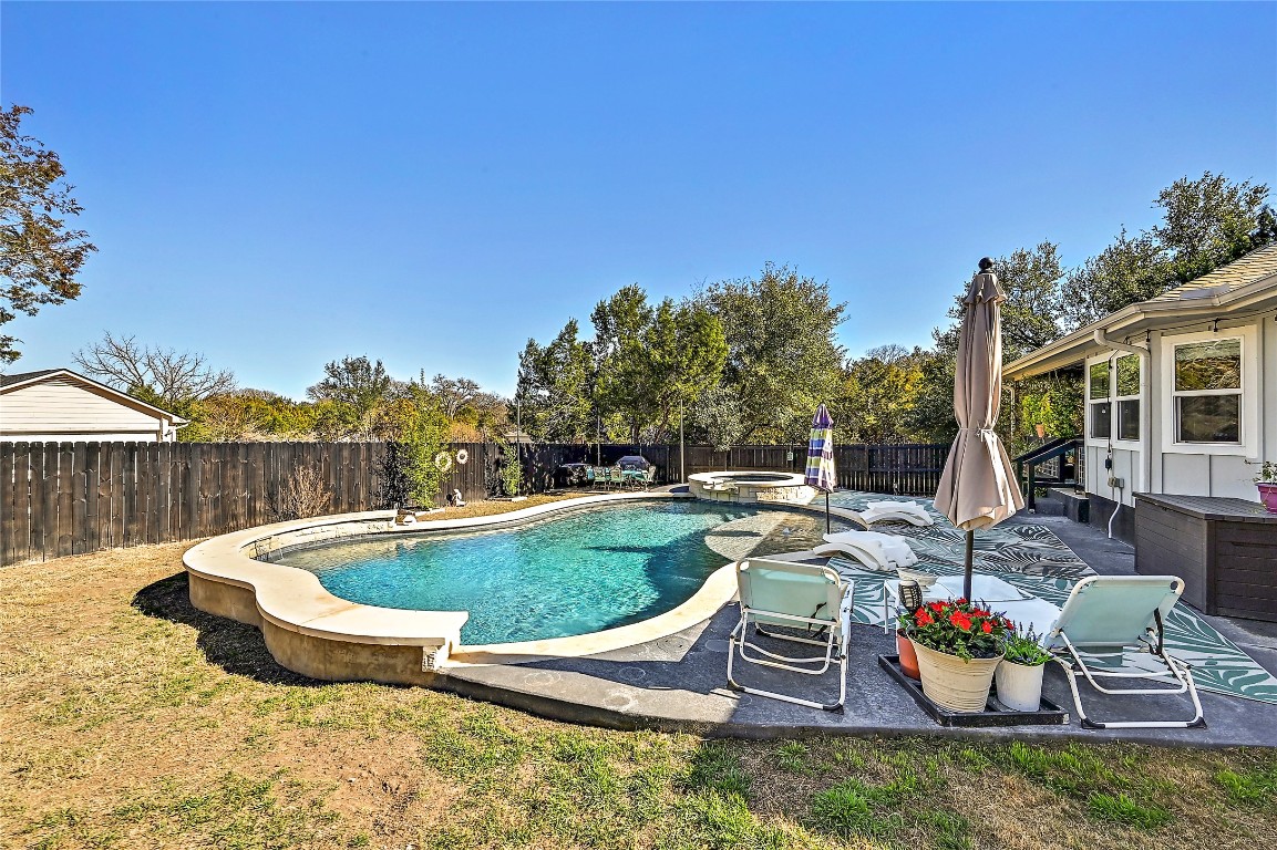 1 Rolling Hills Road Wimberley, TX 78676 - Photo 29 of 30 a view of a swimming pool with a patio