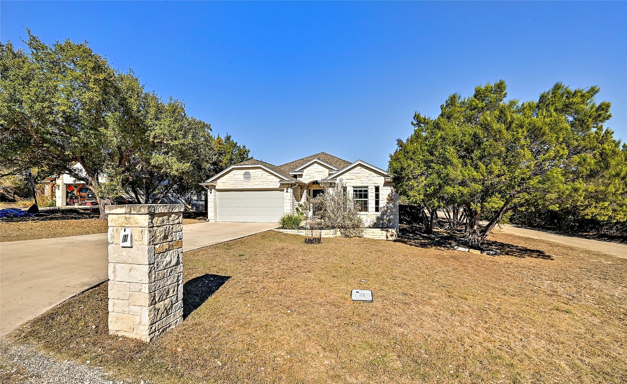 1 Rolling Hills Road Wimberley, TX 78676 - Photo 3 of 30 a view of house with yard and covered with snow in the background