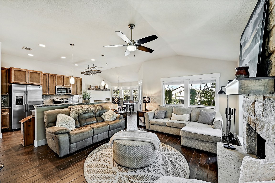1 Rolling Hills Road Wimberley, TX 78676 - Photo 6 of 30 a living room with furniture and a chandelier