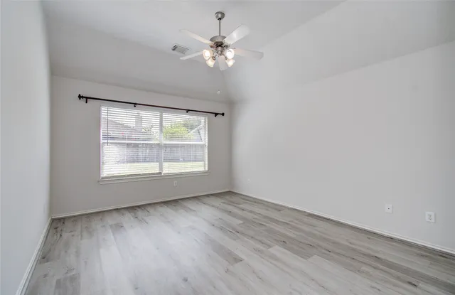 a bathroom with a tub shower and a sink