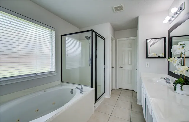 a bathroom with a bathtub and a sink