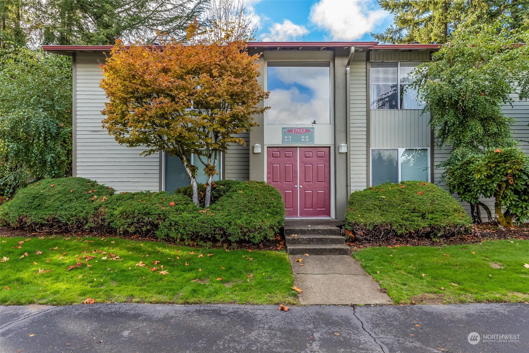 17533 151st Avenue Southeast, Unit 7 Renton, WA 98058 - Photo 1 of 30 a front view of a house with garden