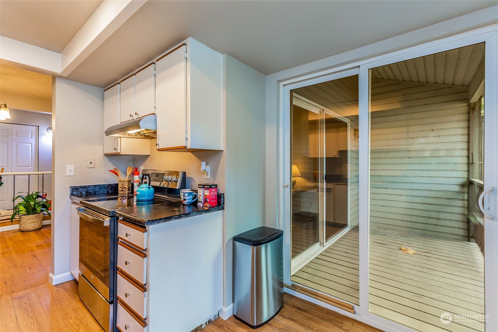 17533 151st Avenue Southeast, Unit 7 Renton, WA 98058 - Photo 13 of 30 a kitchen with stainless steel appliances granite countertop a sink and cabinets