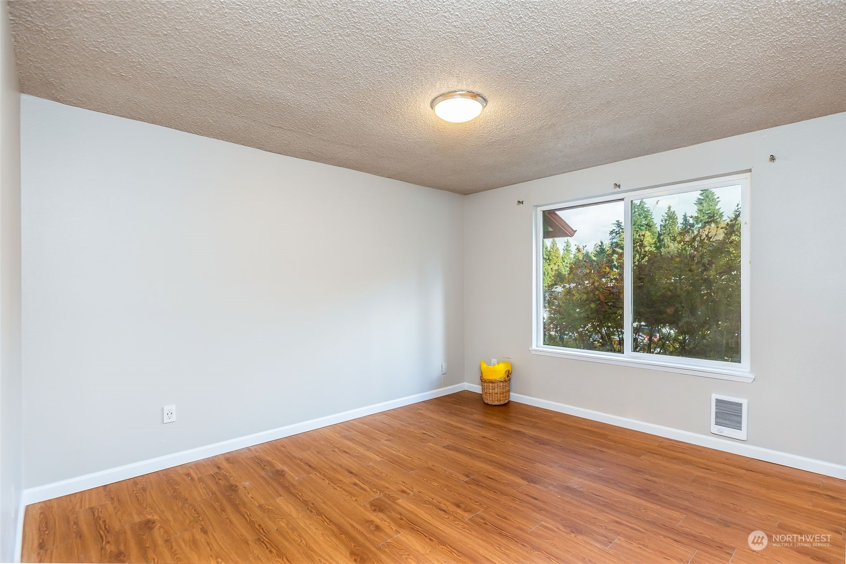 17533 151st Avenue Southeast, Unit 7 Renton, WA 98058 - Photo 16 of 30 a view of empty room with wooden floor and fan