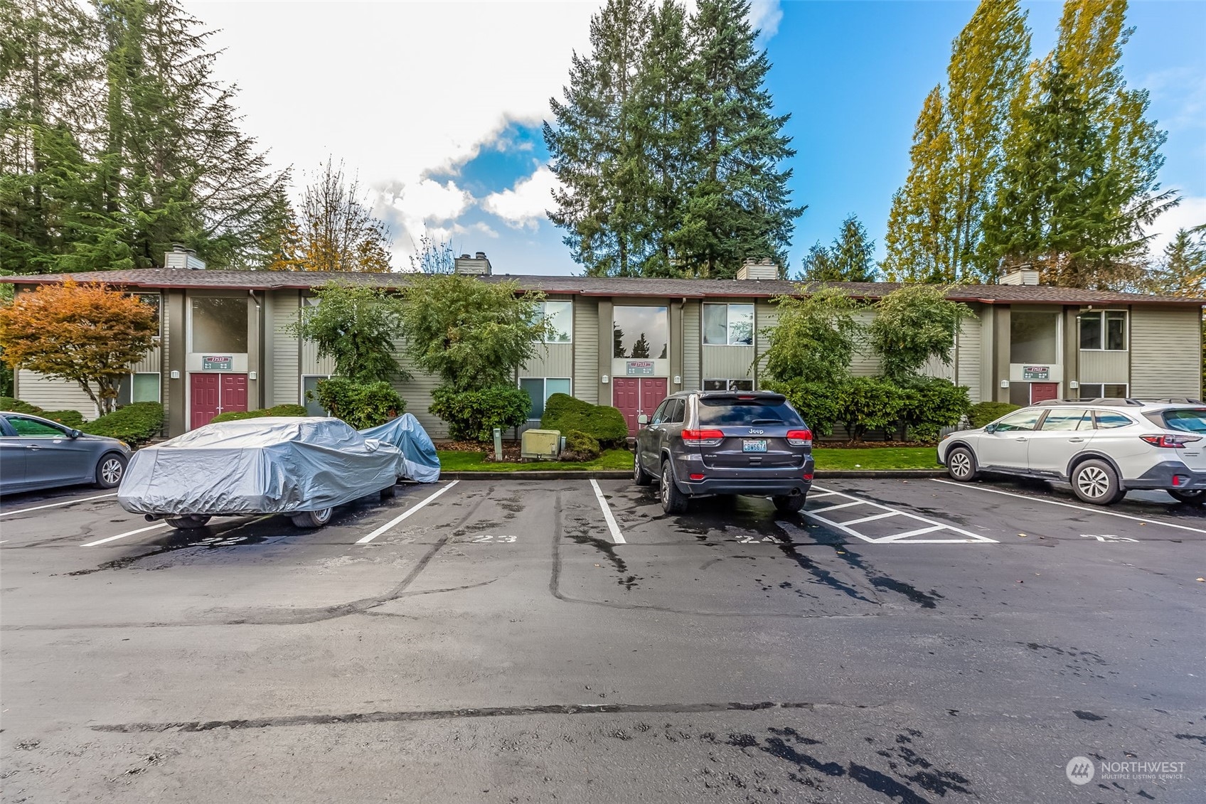 17533 151st Avenue Southeast, Unit 7 Renton, WA 98058 - Photo 29 of 30 a car parked in front of a house