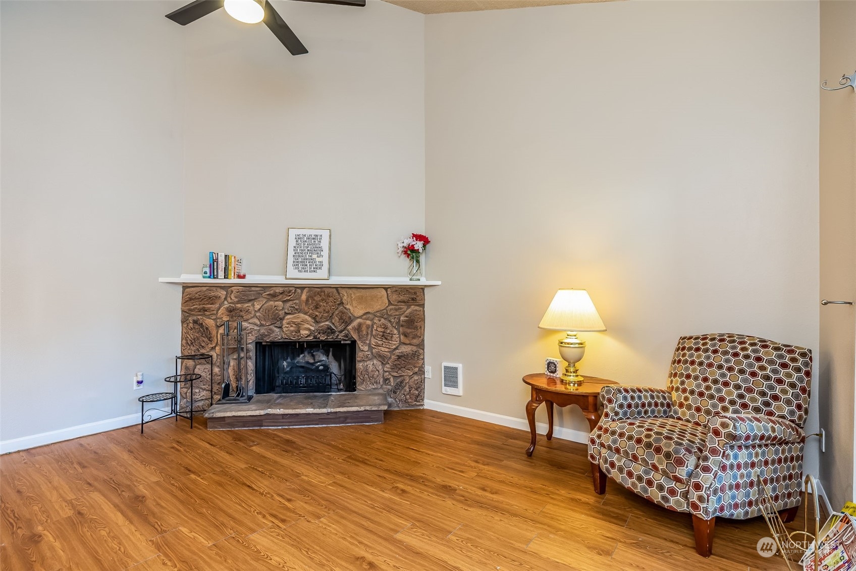 17533 151st Avenue Southeast, Unit 7 Renton, WA 98058 - Photo 7 of 30 a living room with furniture and a fireplace
