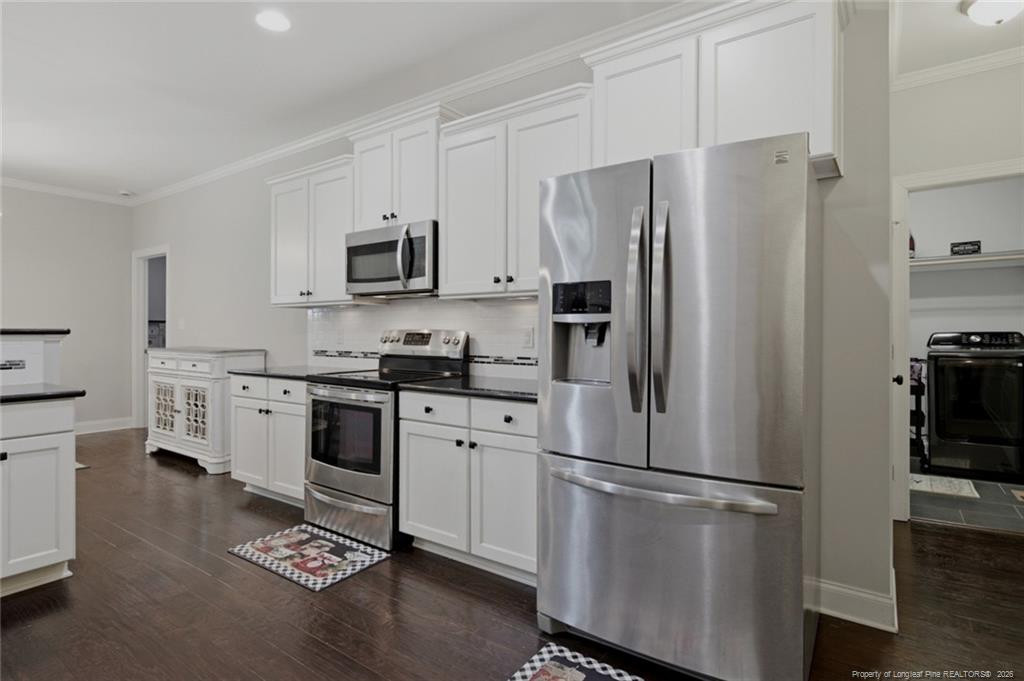 95 Valley Brook Lane Spring Lake, NC 28390 - Photo 18 of 49 a kitchen with stainless steel appliances a refrigerator stove and microwave
