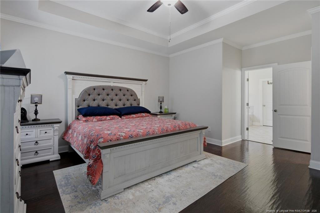 95 Valley Brook Lane Spring Lake, NC 28390 - Photo 21 of 49 a bedroom with a bed and wooden floor