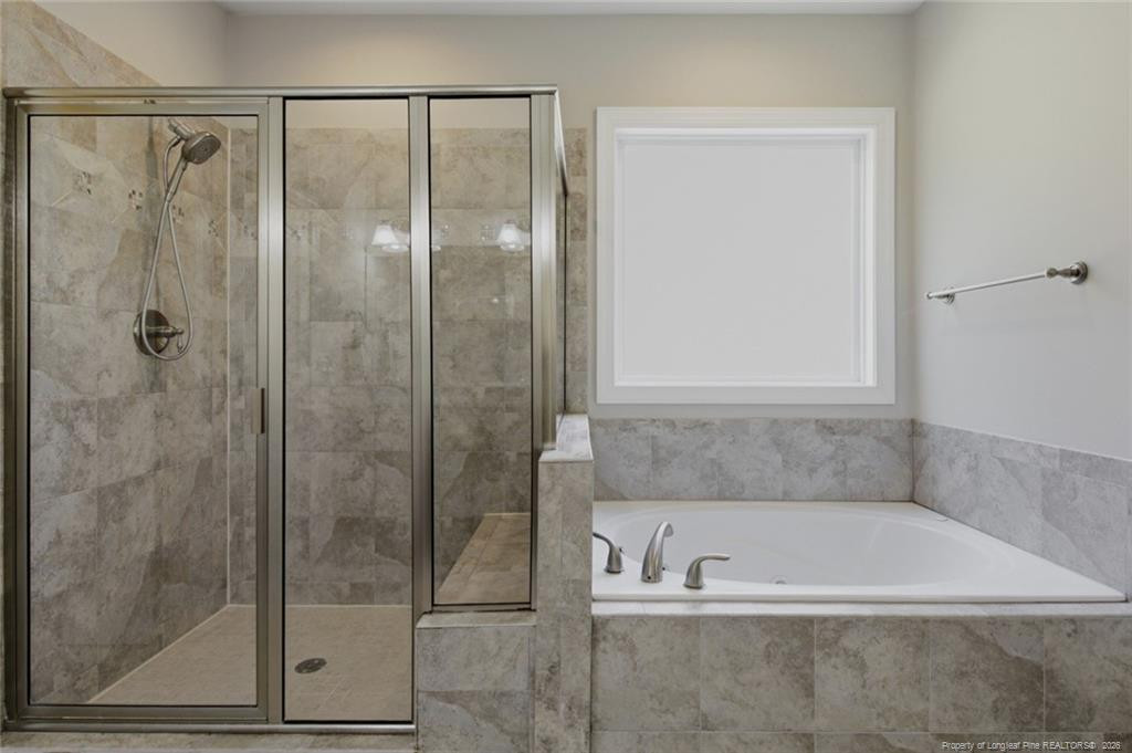 95 Valley Brook Lane Spring Lake, NC 28390 - Photo 25 of 49 a bathroom with a bathtub and shower