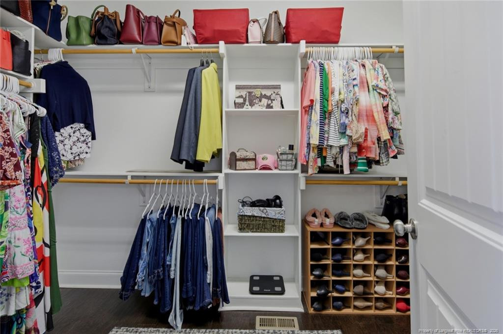 95 Valley Brook Lane Spring Lake, NC 28390 - Photo 26 of 49 a view of walk in closet with clothes and shoes