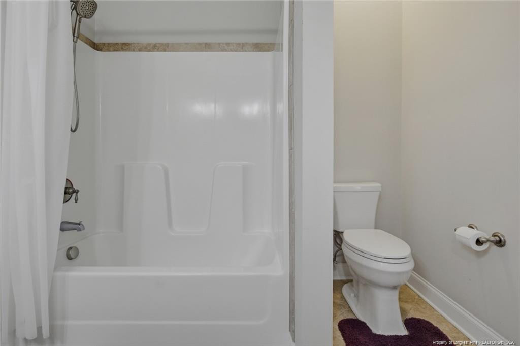 95 Valley Brook Lane Spring Lake, NC 28390 - Photo 39 of 49 a bathroom with a toilet and a bathtub