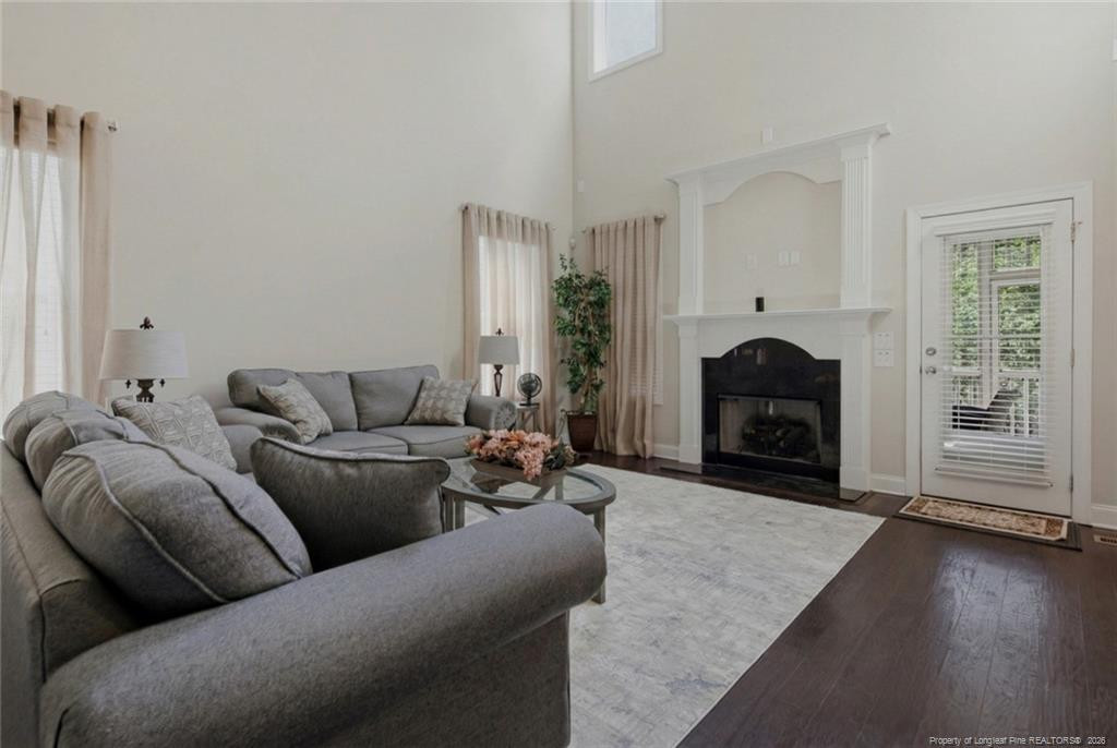 95 Valley Brook Lane Spring Lake, NC 28390 - Photo 10 of 49 a living room with furniture a window and a fireplace