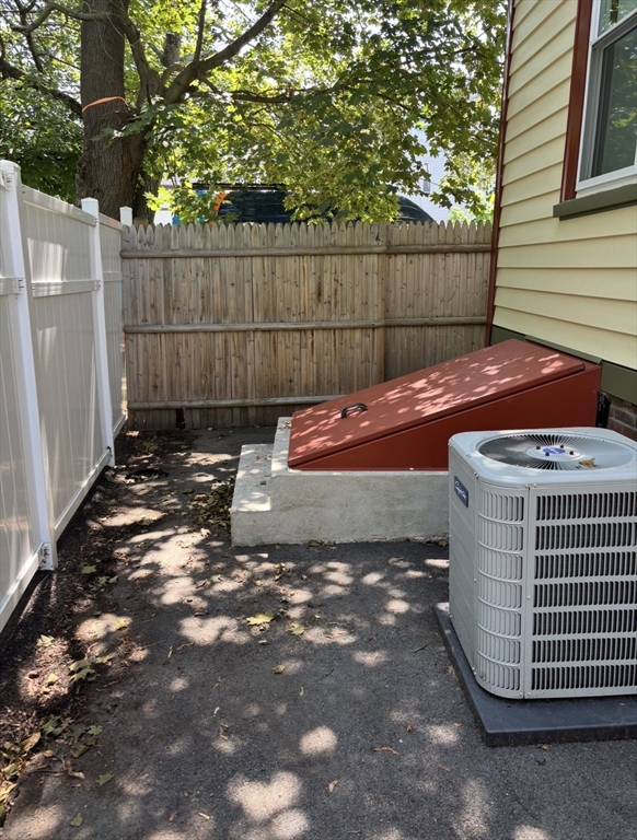13 Moulton Street Lynn, MA 01905 - Photo 14 of 18 a view of a backyard with a small cabin and a chair