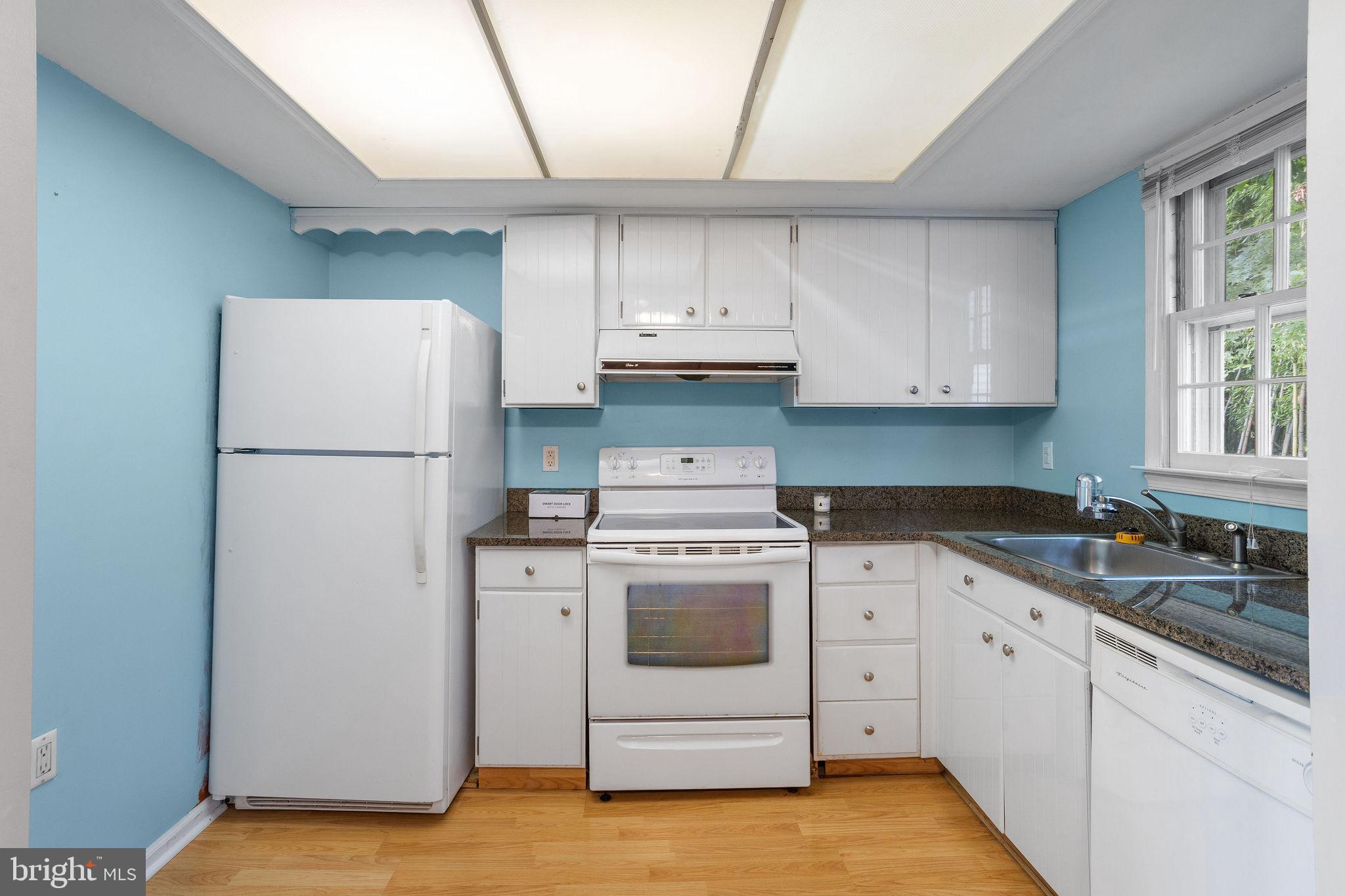 1610 Yardley Commons Yardley, PA 19067 - Photo 6 of 13 a kitchen with a stove sink and refrigerator
