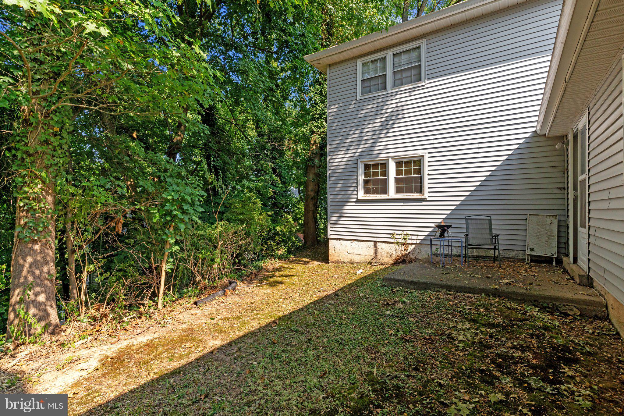1610 Yardley Commons Yardley, PA 19067 - Photo 10 of 13 a view of a backyard with plants and large trees