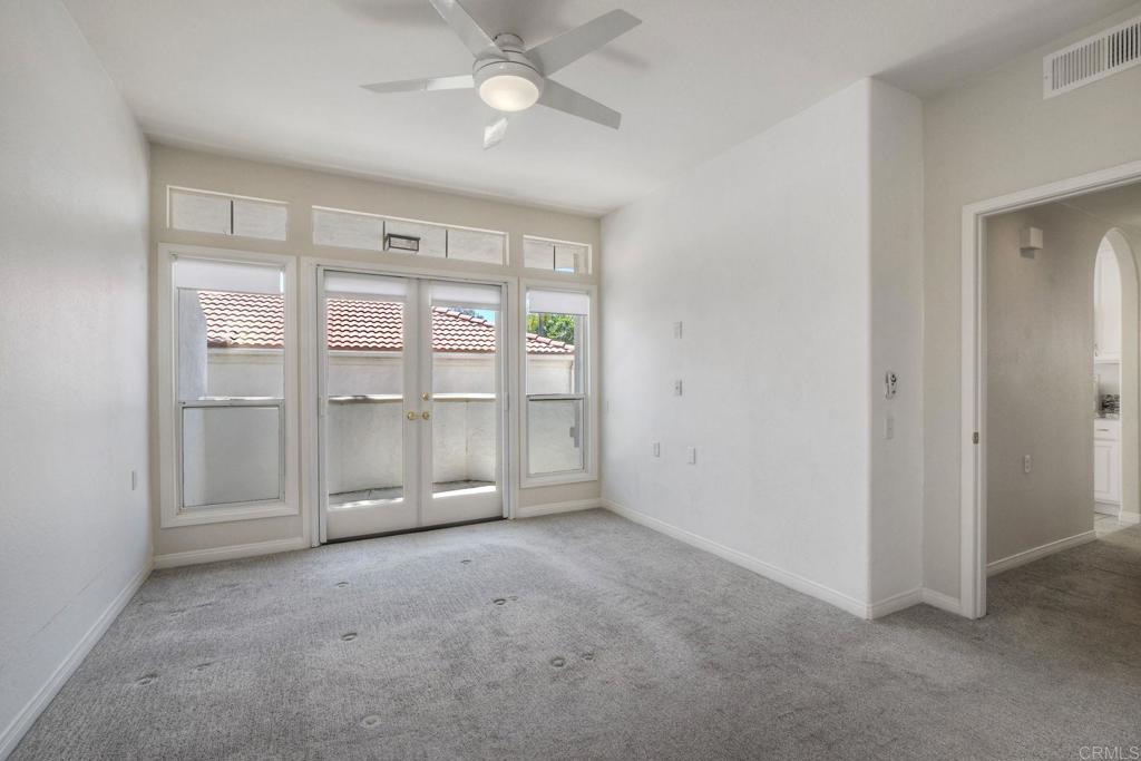 3375 Genoa Way, Unit 144 Oceanside, CA 92056 - Photo 16 of 34 Tall French Doors lead to a private patio.