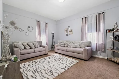 a living room with furniture and a couch