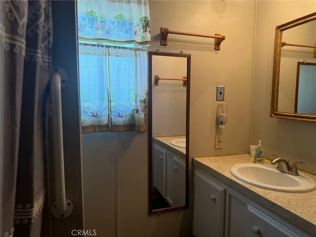 a bathroom with a sink and mirror