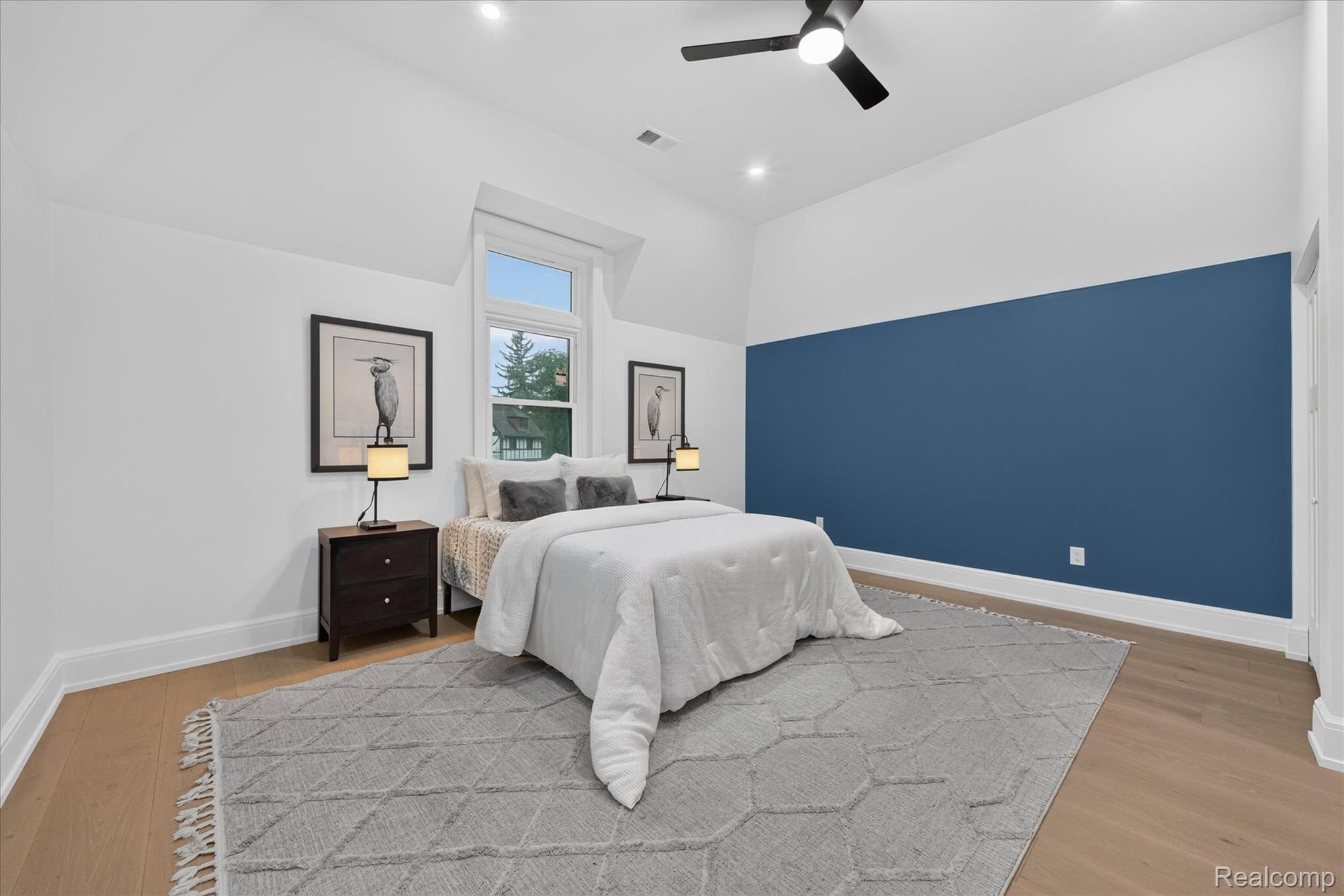 3250 Sherbourne Road Detroit, MI 48221 - Photo 16 of 36 Vaulted ceilings, wood-finish flooring, recessed lighting, and a contemporary ceiling fan