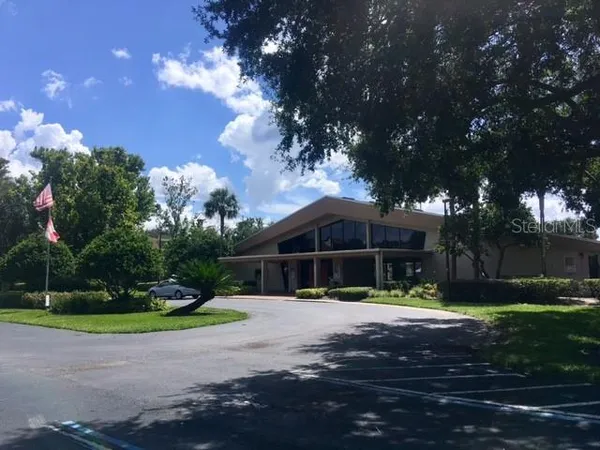 a view of patio with a yard