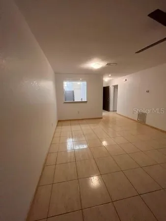 a view of a livingroom and window