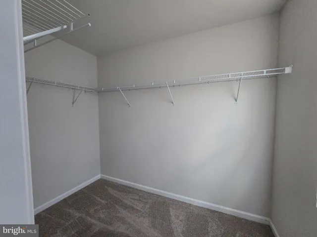 a view of a room with shelf on the wall