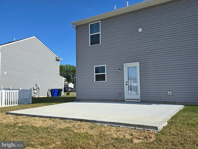 a view of a house with a yard and garage